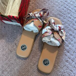 Stylish NJ DEVILS Tan Slide Sandals with Bow Accent